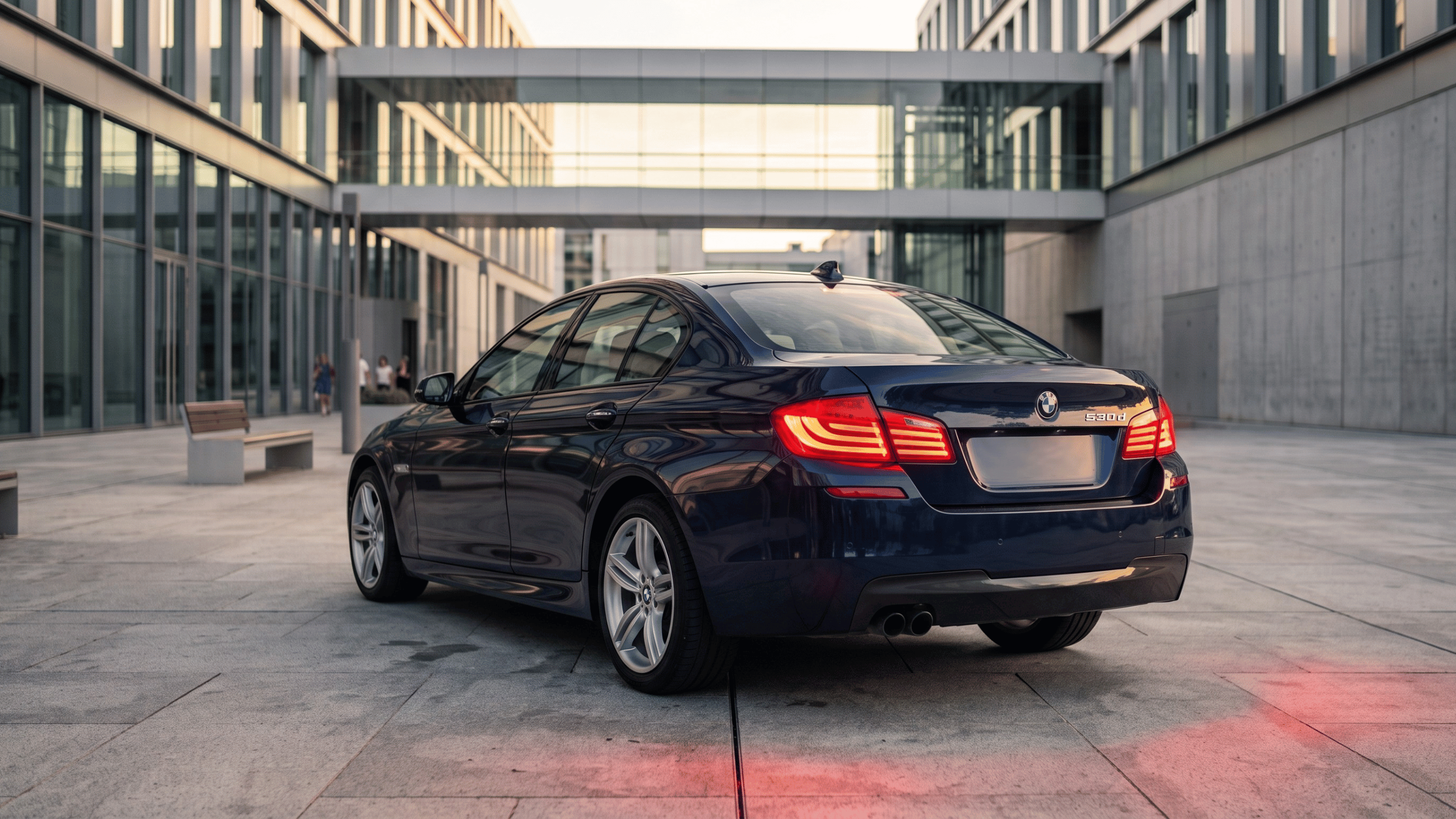 BMW F10 520d rear profile showing sleek executive styling and dual exhaust setup